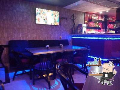 Take a seat at one of the tables at Fire&ice Cafe N Lounge