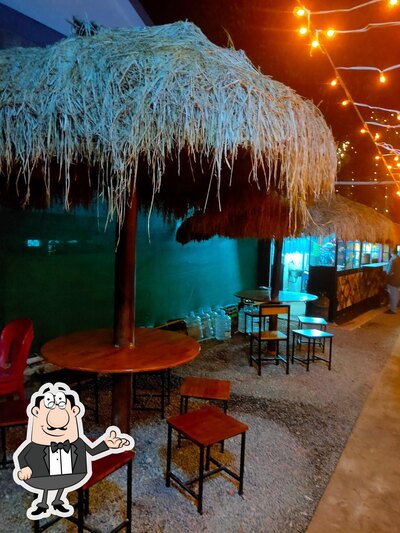 Take a seat at one of the tables at Airavat Family Restaurant