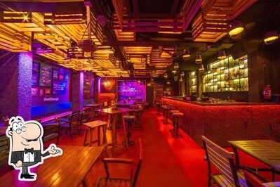 Take a seat at one of the tables at Rude Lounge