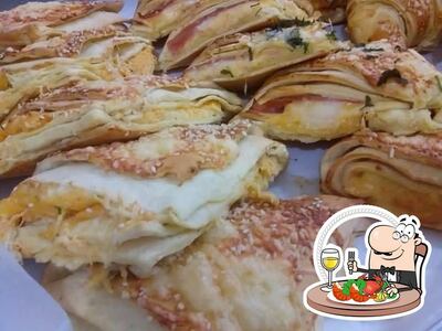 Experimente diferentes pratos de frutos do mar servidos no Padaria Panorama