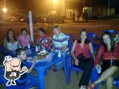 Sente em uma das mesas no Rustikale Pizzaria