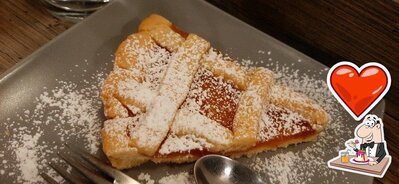 Anhélo caffè serve un'ampia varietà di dessert