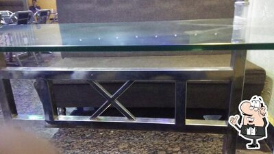 Take a seat at one of the tables at SRI RAM RESTAURANT