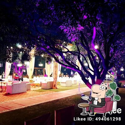 Take a seat at one of the tables at Bagicha lawn & restaurant