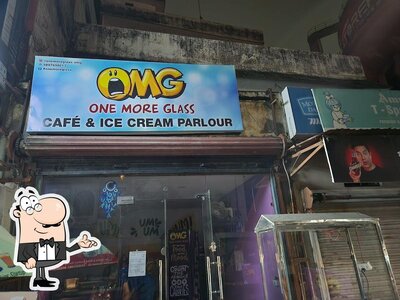 Take a seat at one of the tables at Omg Cafe