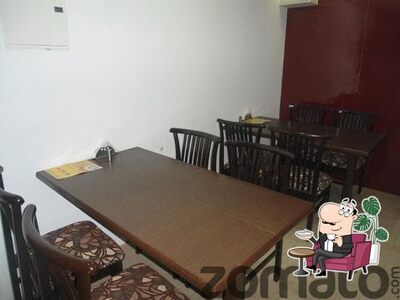 Take a seat at one of the tables at Gupta Restaurant