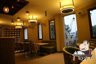 Take a seat at one of the tables at La'Chef Restaurant