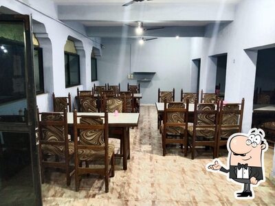 Take a seat at one of the tables at Sagar Restaurant