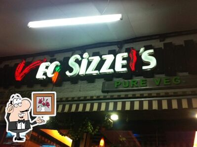 Take a seat at one of the tables at Veg Sizzles