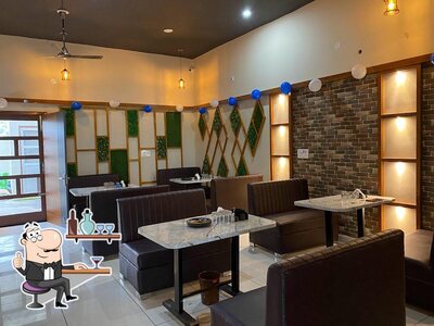 Take a seat at one of the tables at Sandhu Restaurant