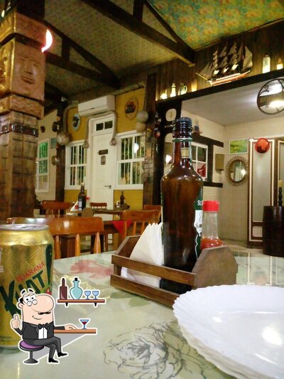 O interior do pizzaria Capitão Mainha