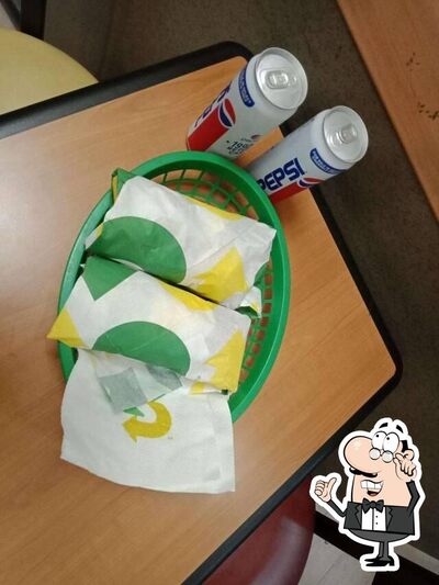 Take a seat at one of the tables at Subway