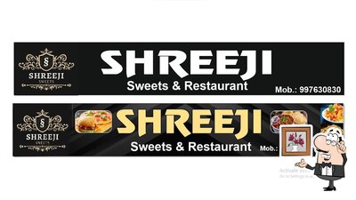 Take a seat at one of the tables at Shree ji restaurant parham house subhash tiraha shikohabad