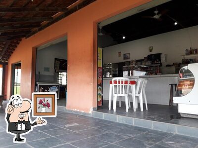Sente em uma das mesas no Restaurante Catarinense