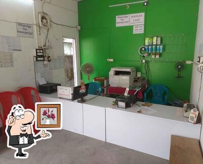 Take a seat at one of the tables at Madras Internet Cafe