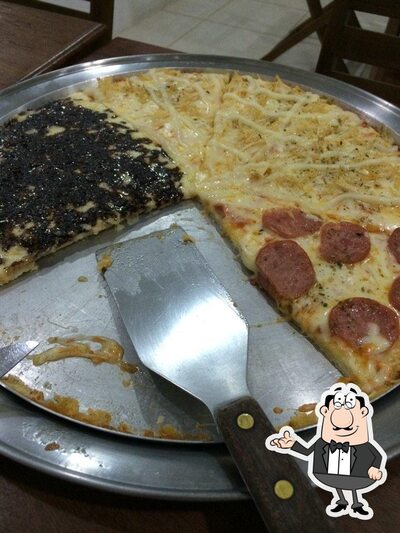 Sente em uma das mesas no Pizzaria Mosseline