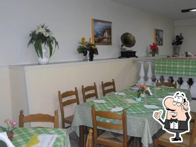Siediti a un tavolo di Pizzeria Il Buongustaio
