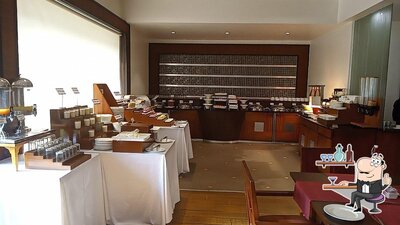 Take a seat at one of the tables at Samarat Restaurant at Chanakya Patna