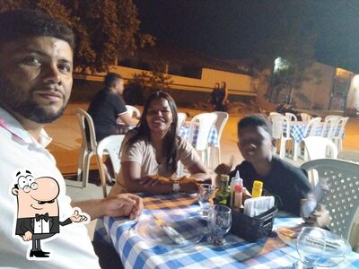 Sente em uma das mesas no Pizzaria Cia do Sabor