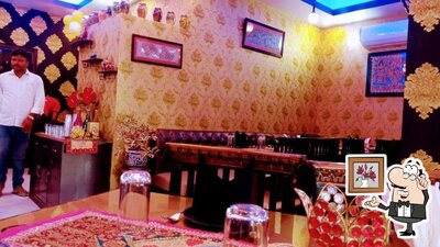 Take a seat at one of the tables at Delhi Lazeez Darbar