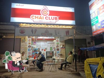 Take a seat at one of the tables at Chai Club