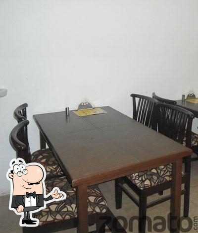 Take a seat at one of the tables at Gupta Restaurant