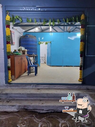 Take a seat at one of the tables at வேலு மெஸ்