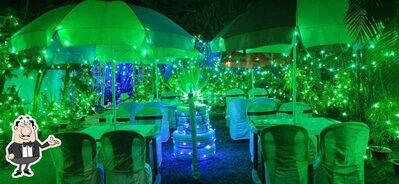 Take a seat at one of the tables at Surja Laxmi Restaurant