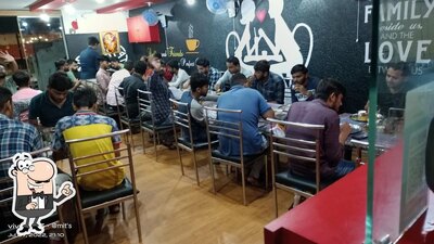 Take a seat at one of the tables at Akshar nasta house