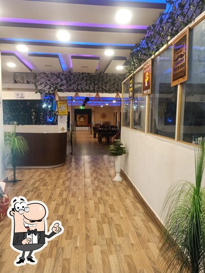 Take a seat at one of the tables at Bundu' Pnada Family Restaurant
