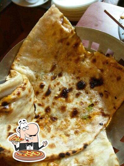 Try out pizza at Guru Kripa Rau -Since 1987