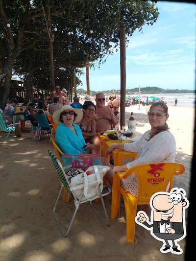 Sente em uma das mesas no Cabana do Xamego