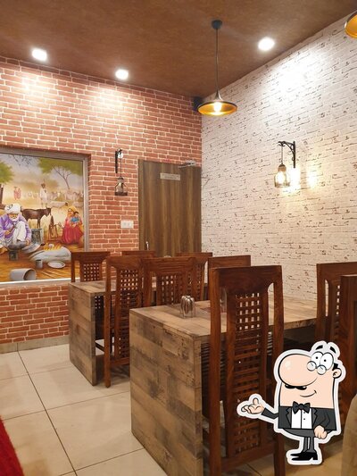 Take a seat at one of the tables at Punjabi chulha