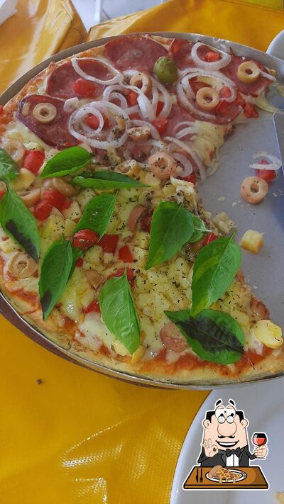 No Restaurante e Pizzaria "O MONTINEIRO", você pode provar pizza