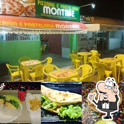 Sente em uma das mesas no Pizzaria e Lanches montese