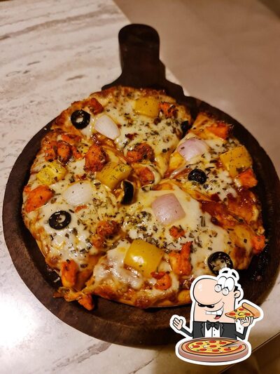 At MCafe Multi Cuisine Restaurants- Lunch home in Kundapura & Kundapura Chicken Special, you can enjoy pizza