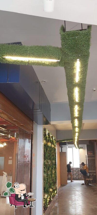 Take a seat at one of the tables at LOTUS RESTAURANT (A Unit of ACCOCCA HOTELS PVT LTD)