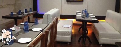 Take a seat at one of the tables at Royal Cafe