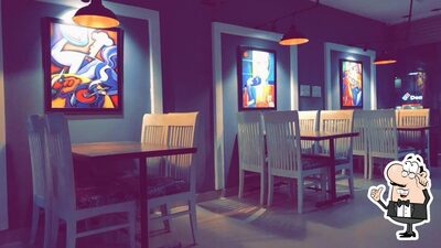 Take a seat at one of the tables at Cook’s Town