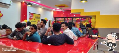 Take a seat at one of the tables at Red Bucket Biryani Rayachoty