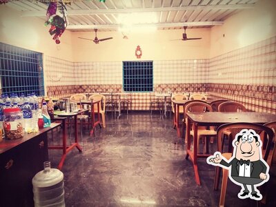 Take a seat at one of the tables at Thirumalai malligai& hotal store