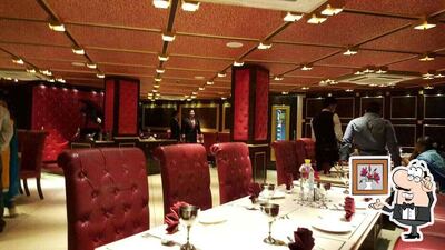 Take a seat at one of the tables at Urban Turban - The Metropolitan Club