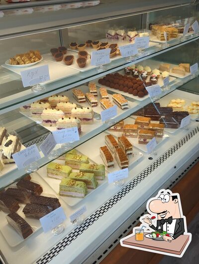 Display case full of cakes and pastries