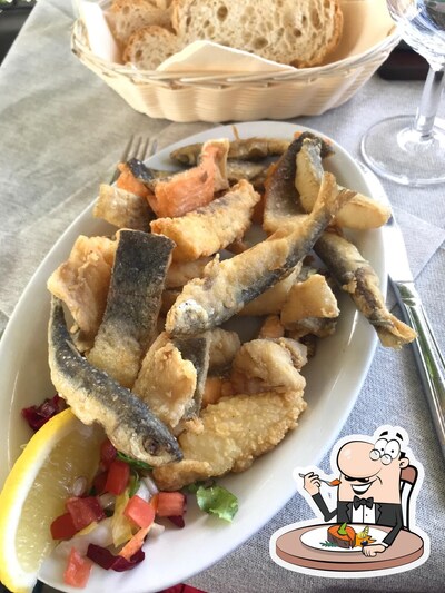 Prenditi i piatti di pesce al ristorante Ristorante Italia
