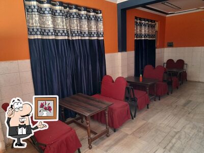 Take a seat at one of the tables at Duck Chik The Fooding Point