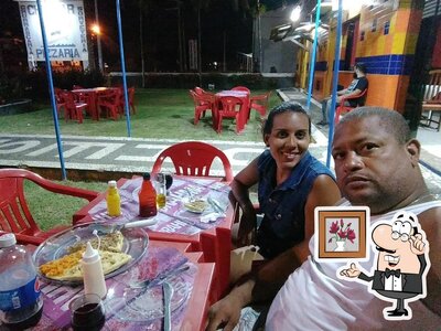 O interior do Chesmar Pizzaria