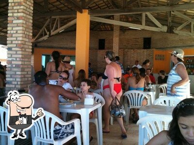 Sente em uma das mesas no Restaurante Do Augusto