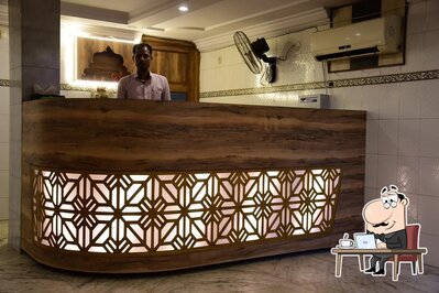 Take a seat at one of the tables at Purnima Restaurant
