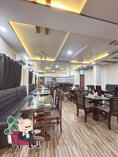 Take a seat at one of the tables at Godavari Military Restaurant