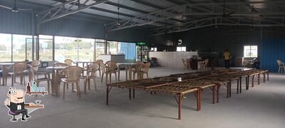 Take a seat at one of the tables at Runicha ramdev dhaba
